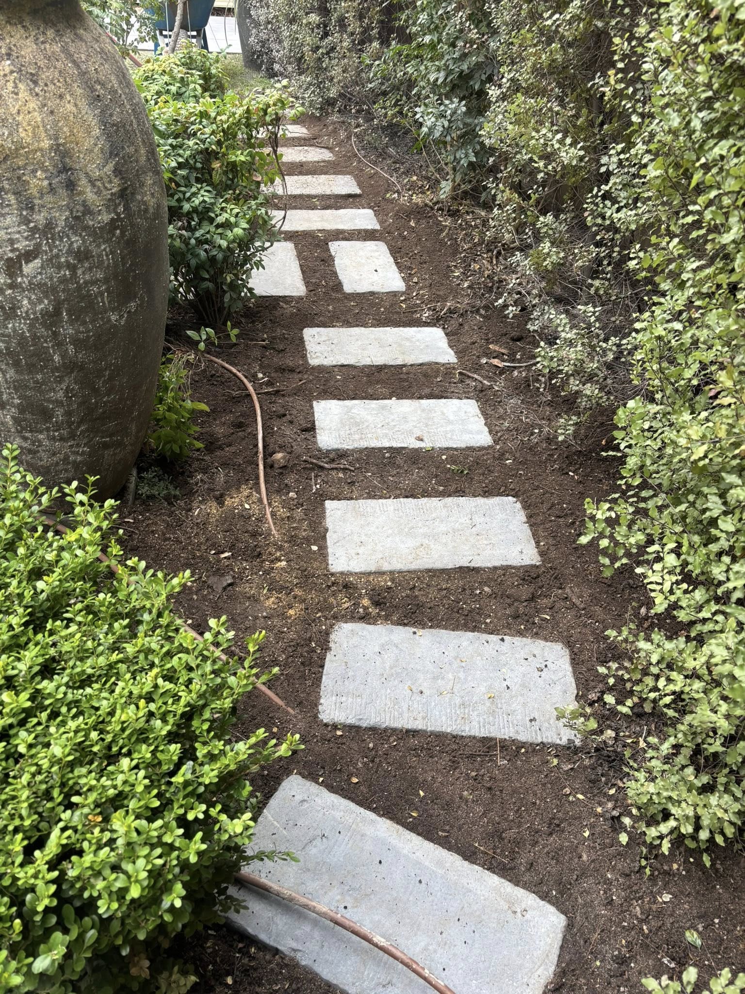 Garden stepping stone path installation — landscaping and garden beds